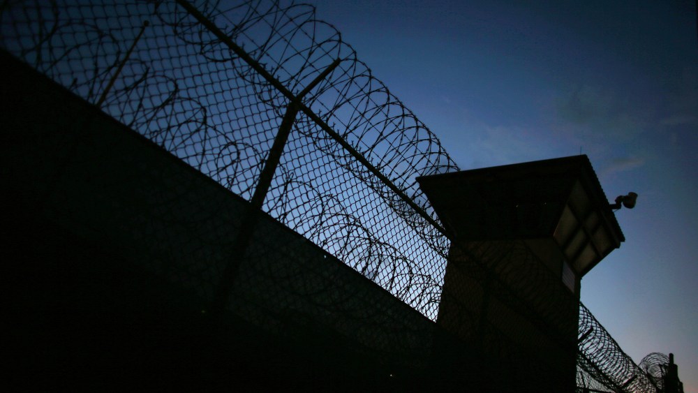 Razor wire is seen near the guard tower at the entrance to Camp V and VI at the U.S. military prison for 'enemy combatants' on June 26, 2013 in Guantanamo Bay, Cuba. (Photo by Joe Raedle/Getty)