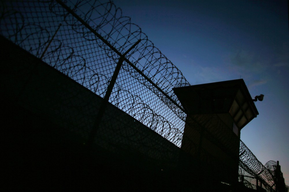 Razor wire is seen near the guard tower at the entrance to Camp V and VI at the U.S. military prison for 'enemy combatants' on June 26, 2013 in Guantanamo Bay, Cuba. (Photo by Joe Raedle/Getty)