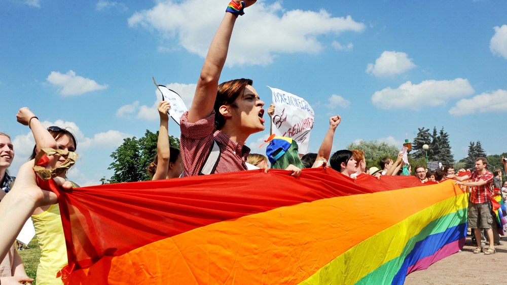 Gay rights activists take part in a gay pride event in Saint Petersburg on June 29, 2013.