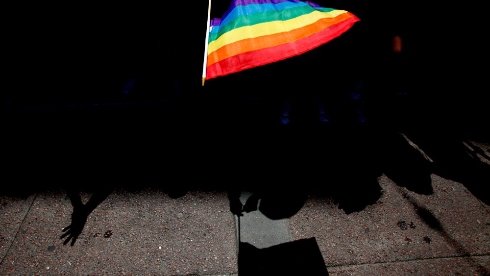A parade goer waves a flag during 43rd annual San Francisco LGBT Pride Celebration & Parade, June 30, 2013, in San Francisco, Calif.
