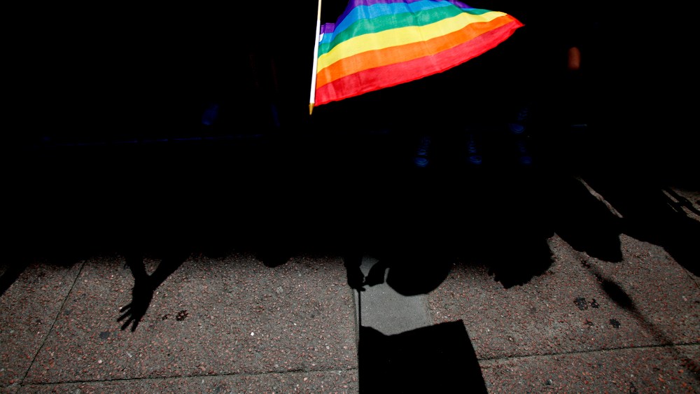 A parade goer waves a flag during 43rd annual San Francisco Lesbian, Gay, Bisexual, Transgender (LGBT) Pride Celebration & Parade June 30, 2013, in San Francisco, Calif. (Photo by Sarah Rice/Getty)