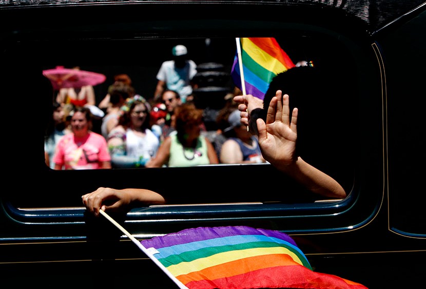 One of the historic cars makes its way down Market St. during the 43rd annual San Francisco Lesbian, Gay, Bisexual, Transgender (LGBT) Pride Celebration & Parade June 30, 2013, in San Francisco, California.  (Photo by Sarah Rice/Getty Images)