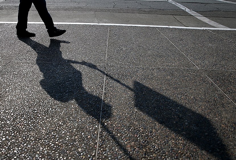 A Bay Area Rapid Transit (BART) union worker with SEIU Local 1021 walks a picket line in front of the Lake Merritt station on July 1, 2013 in Oakland, California. (Photo by Justin Sullivan/Getty Images)