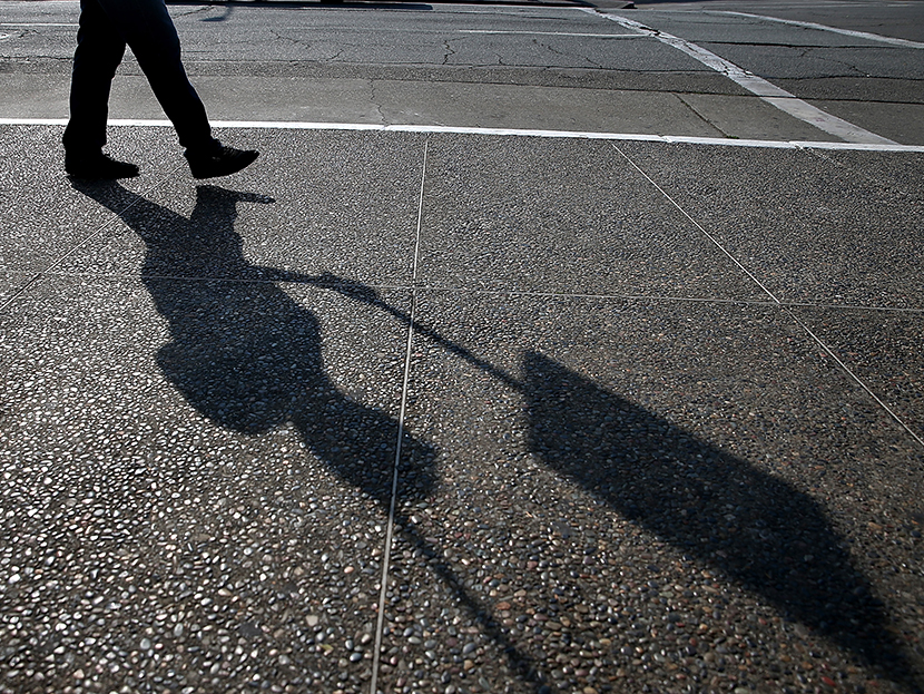 A Bay Area Rapid Transit (BART) union worker with SEIU Local 1021 walks a picket line in front of the Lake Merritt station on July 1, 2013 in Oakland, California. (Photo by Justin Sullivan/Getty Images)