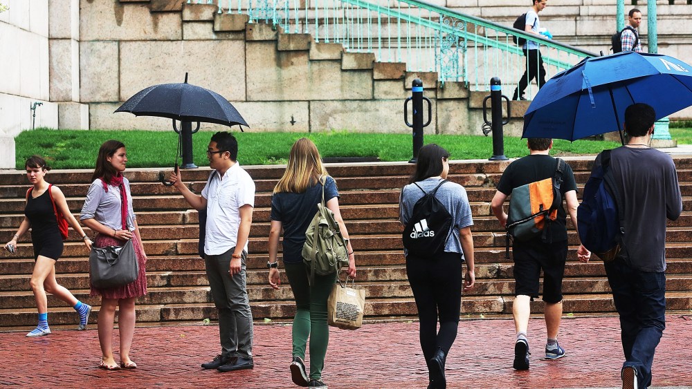 People walk on the Columbia University campus on July 1, 2013 in New York City.