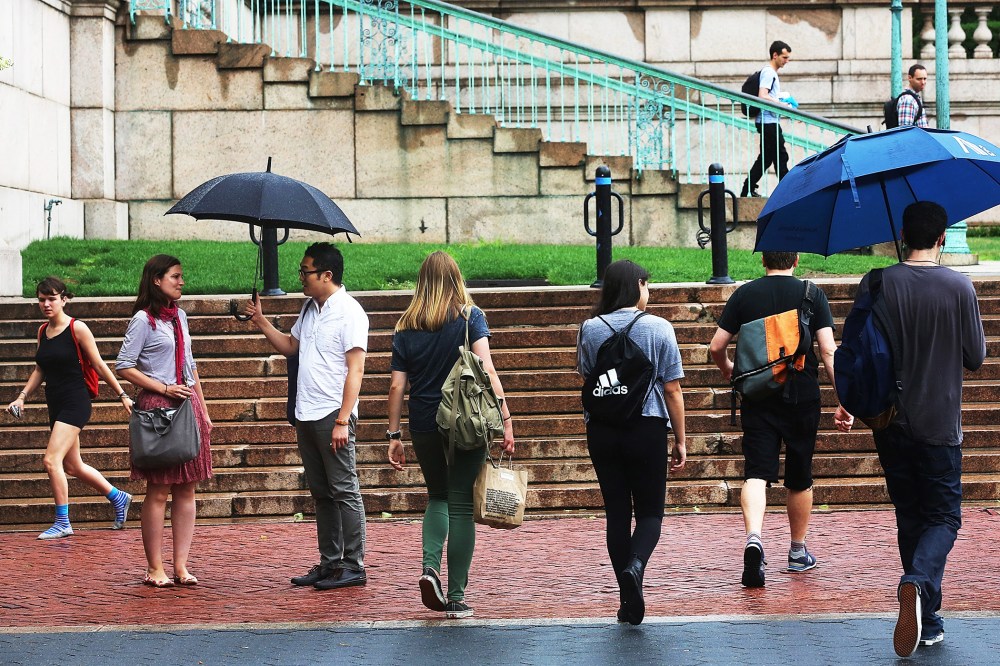People walk on the Columbia University campus on July 1, 2013 in New York City.