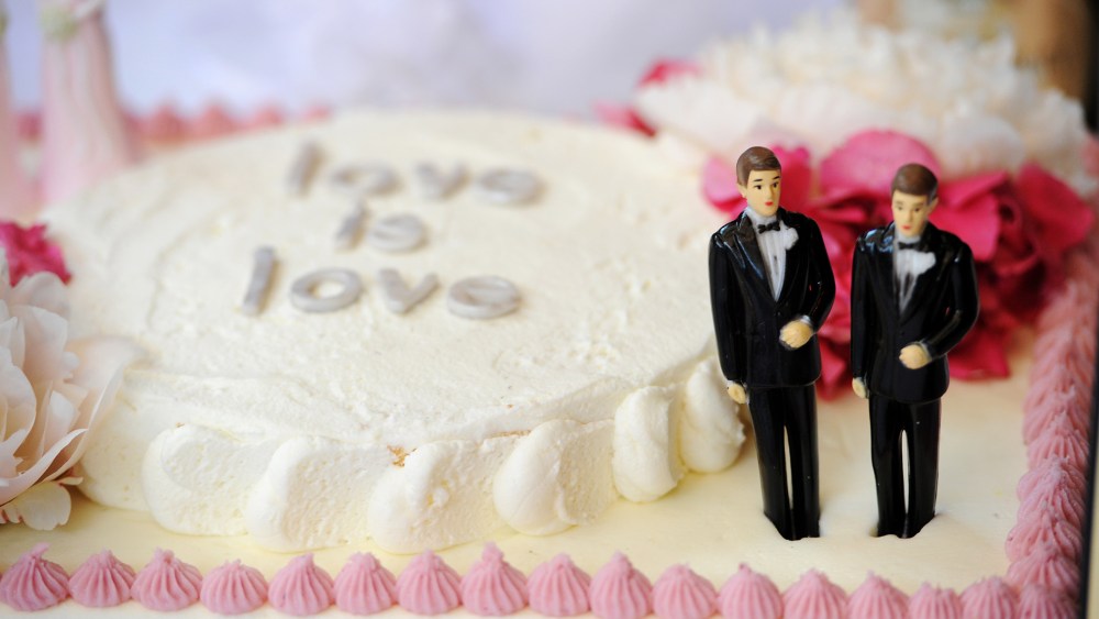A wedding cake with a male couple is seen at a same-sex marriage celebration, July 1 2013.