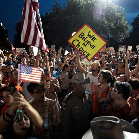 Pro-life supporters and pro-choice protesters rally at the Texas state capitol in favor and against the new controversial abortion legislation up for a vote in the state legislature on July 8, 2013 in Austin Texas. (Photo by Erich Schlegel/Getty Images)