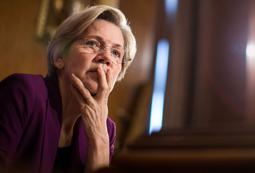 U.S. Sen. Elizabeth Warren (D-MA) listens to testimony from witnesses during a Senate Banking, Housing and Urban Affairs Committee hearing on "Mitigating Systemic Risk Through Wall Street Reforms," on Capitol Hill, July 11, 2013 in Washington, DC.  ...