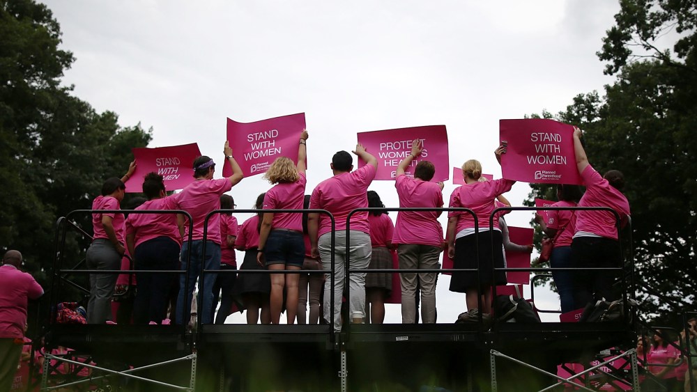 People hold up signs during a women's pro-choice rally on Capitol Hill on July 11, 2013 in Washington, DC. (Mark Wilson/Getty)