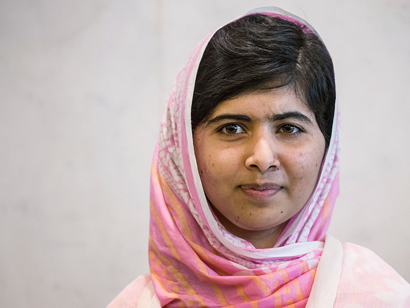 Malala Yousafzai, the 16-year-old Pakistani advocate for girls education who was shot in the head by the Taliban, pauses for a media photo opportunity while attending the United Nations Youth Assembly on July 12, 2013 in New York City. (Photo by Andrew...