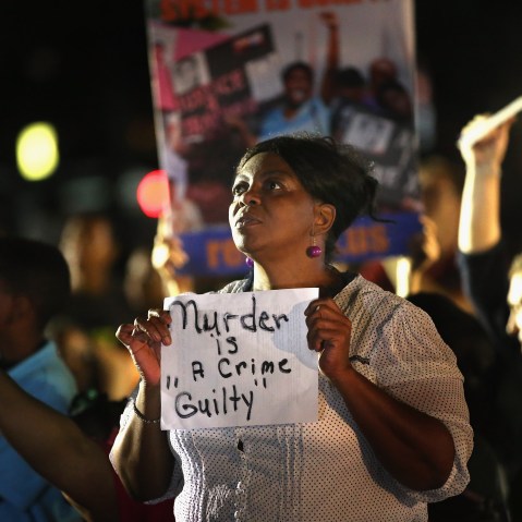 SANFORD, FL - JULY 13:  Supporters of Trayvon Martin wait in front of the Seminole County Criminal Justice Center for the verdict to be announced in the George Zimmerman murder trial on July 13, 2013 in Sanford, Florida. The jury found Zimmerman, a...