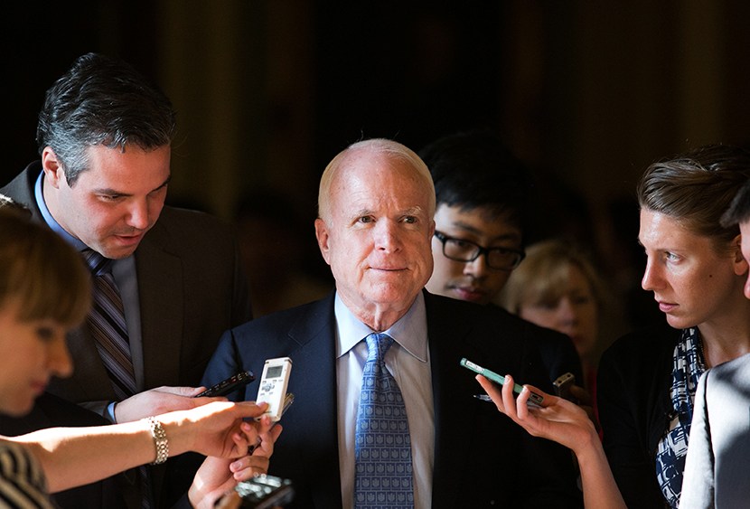 Sen. John McCain (R-AZ) talks with reporters as he walks to a Senate joint caucus meeting, on Capitol Hill, July 15, 2013 in Washington, DC.  (Photo by Drew Angerer/Getty Images)