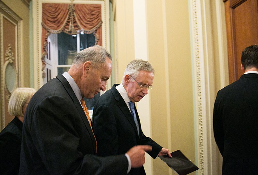 Sen. Chuck  Schumer (D-NY) and Senate Majority Leader Harry Reid (D-NV) walk to Reid's office after Senate joint caucus meeting, on July 15, 2013 in Washington, DC.  (Photo by Drew Angerer/Getty Images)