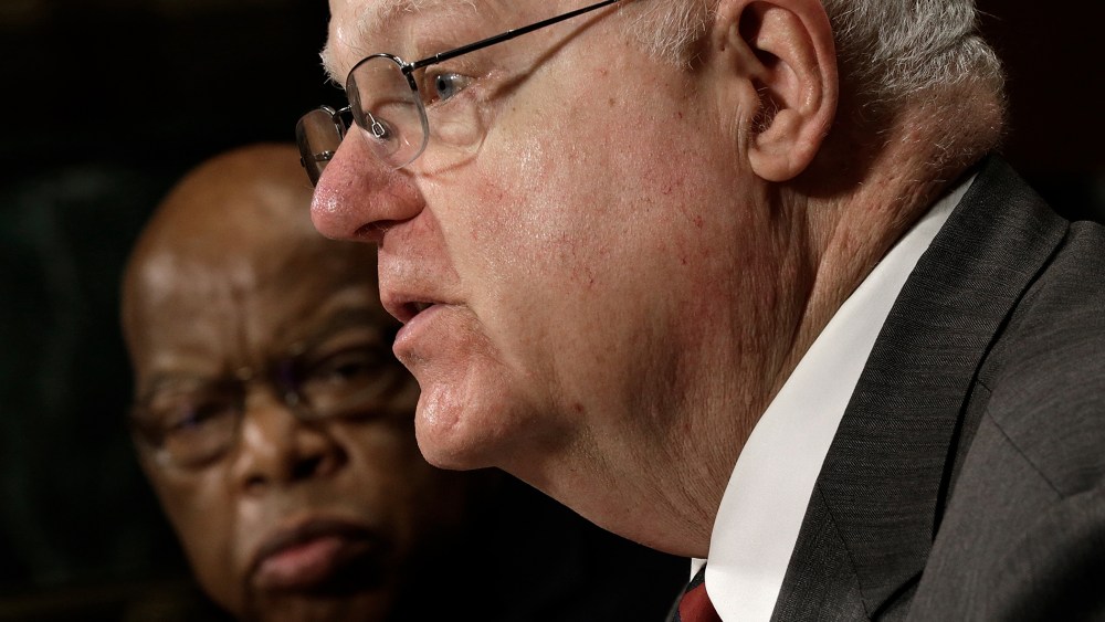 Rep John Lewis (D-GA) (L) listens as Rep. Jim Sensenbrenner (R-WI) testifies before the Senate Judiciary Committee on July 17, 2013 in Washington, DC.