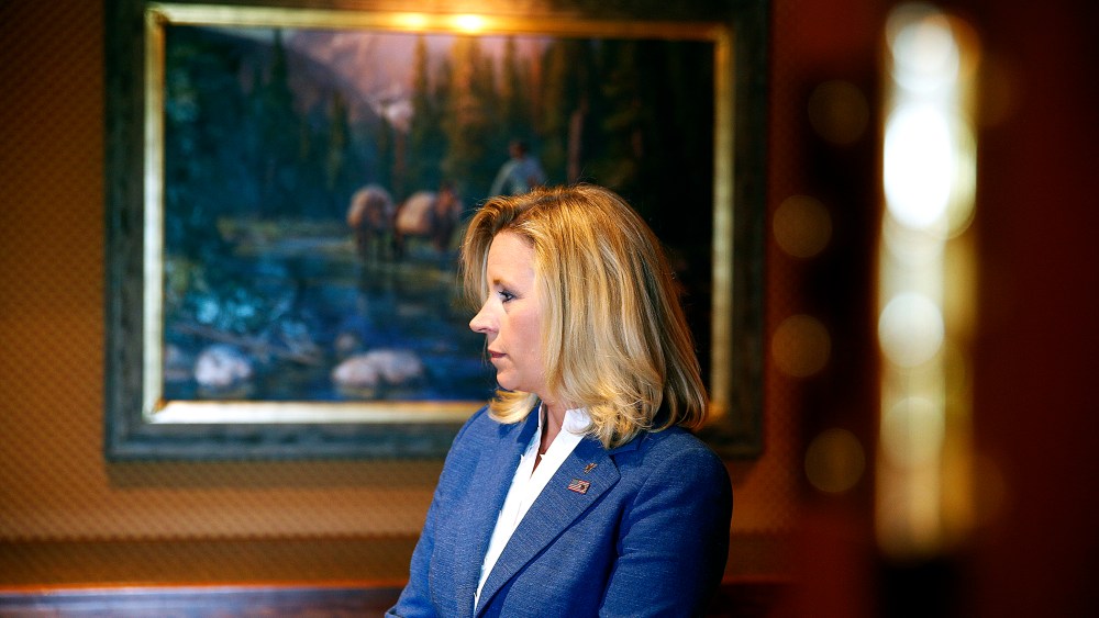 Liz Cheney waits in the hallway for a news conference to begin in Cheyenne, Wyoming, July 17, 2013.