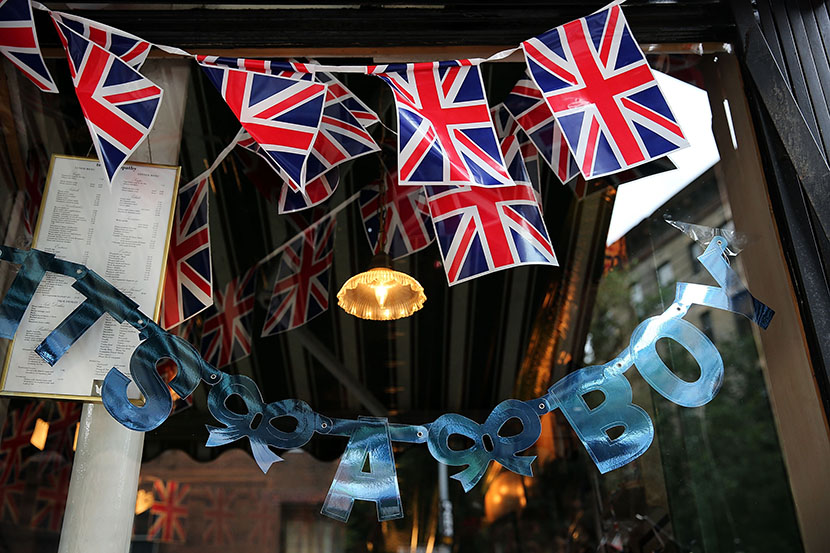A sign in the window of the British restaurant and grocery Tea & Sympathy reads. "It's A Boy" as it celebrates the birth of Catherine, Duchess of Cambridge, and her husband Prince William's first child on July 22, 2013 in New York City. (Photo by...