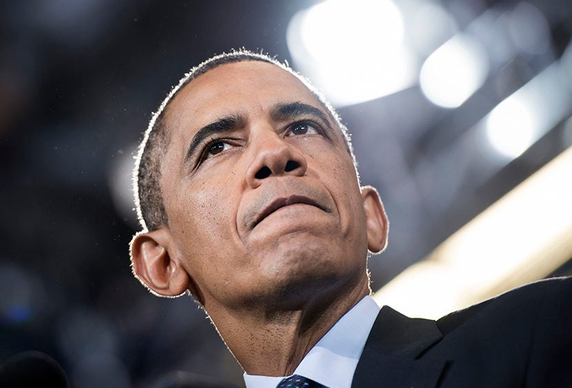 President Barack Obama pauses while speaking at Knox College July 24, 2013, in Galesburg, Ill. Obama is traveling to Illinois and Missouri to speak about the economy. (Photo by Brendan Smialowski/AFP/Getty Images)