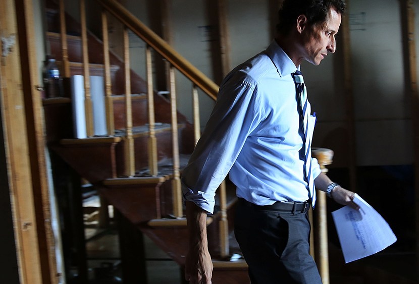 Anthony Weiner, a leading candidate for New York City mayor, walks out of a storm damaged home after meeting with residents in Staten Island whose homes were damaged by Hurricane Sandy on July 26, 2013 in New York City. (Photo by Spencer Platt/Getty...