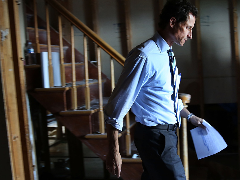 Anthony Weiner, a leading candidate for New York City mayor, walks out of a storm damaged home after meeting with residents in Staten Island whose homes were damaged by Hurricane Sandy on July 26, 2013 in New York City. (Photo by Spencer Platt/Getty...