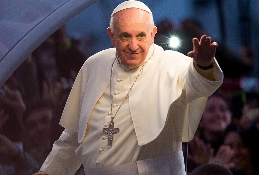 Pope Francis waves from the Popemobile on his way to attend the Via Crucis on Copacabana Beach during World Youth Day celebrations on July 26, 2013 in Rio de Janeiro, Brazil. (Photo by Buda Mendes/Getty Images)