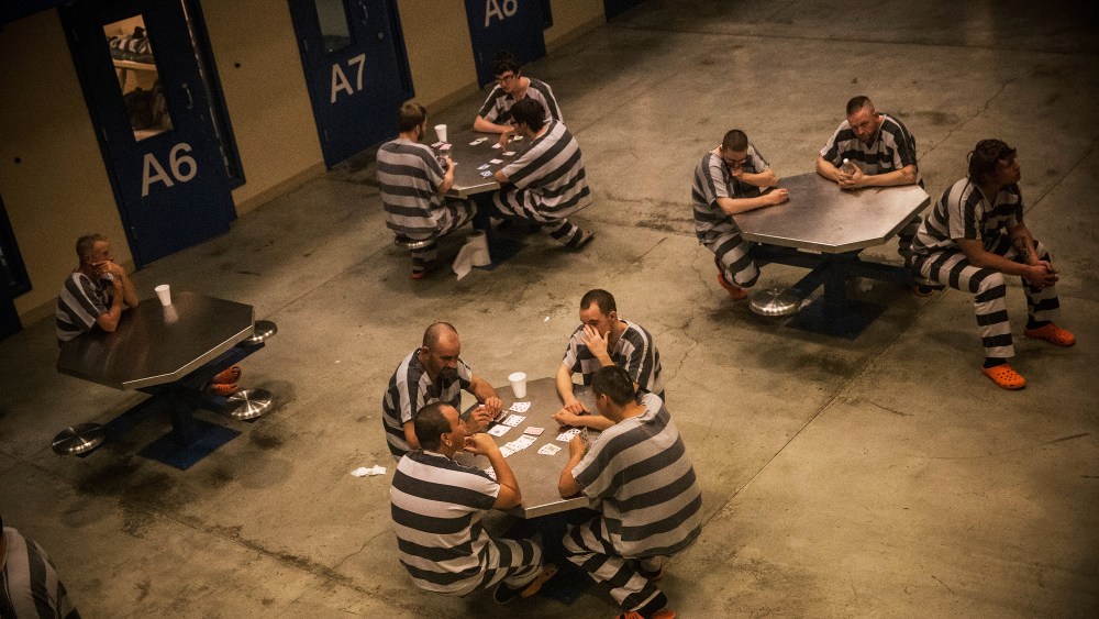 Inmates sit in the county jail in Williston, ND, July 26, 2013.