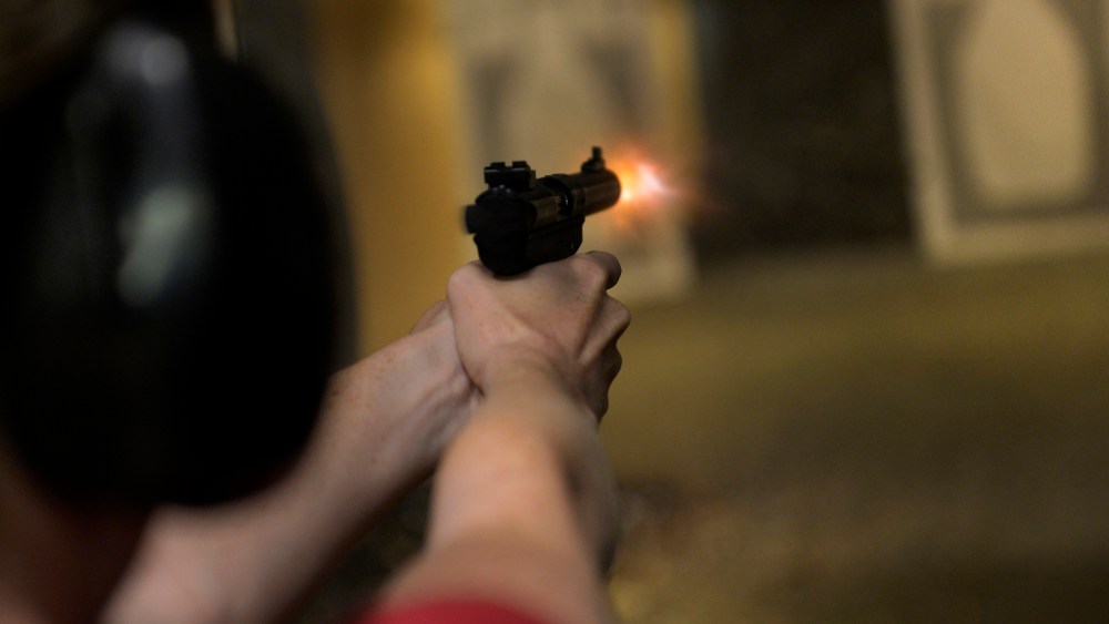 A woman fires her handgun during a Multi-State Concealed Carry class at a shooting range in Centennial, CO July 27, 2013.