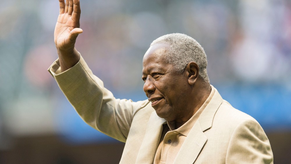 Baseball Hall of Famer Hank Aaron waves to the crowd before the start of the Washington Nationals game at Miller Park on Aug. 2, 2013 in Milwaukee, Wisc.