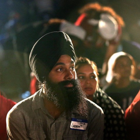 Members of the Sikh Temple of Wisconsin, their guests and supporters attend a vigil to mark the one-year anniversary of the shooting at the temple Aug. 5, 2013 in Oak Creek, Wis. (Photo by Scott Olson/Getty)