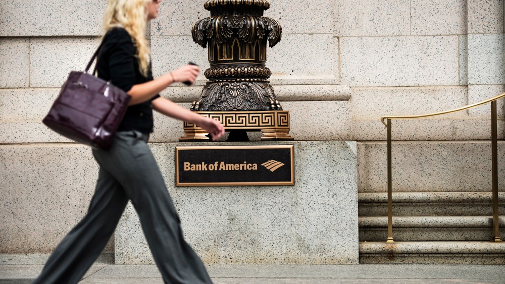 A woman walks past a Bank of America in Washington, DC., Aug. 7, 2013.