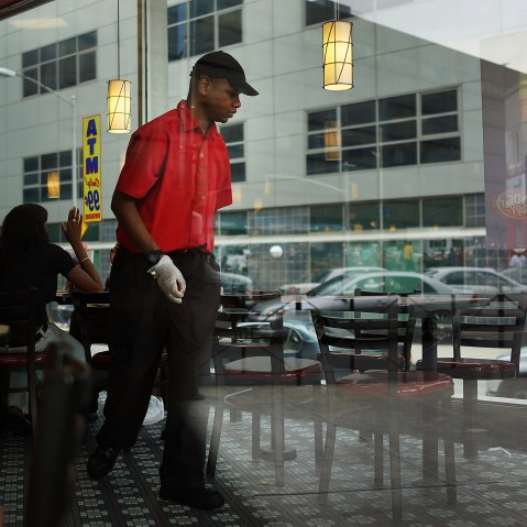 A man works inside a McDonald's restaurant on Aug. 23, 2013 in Brooklyn, NY.