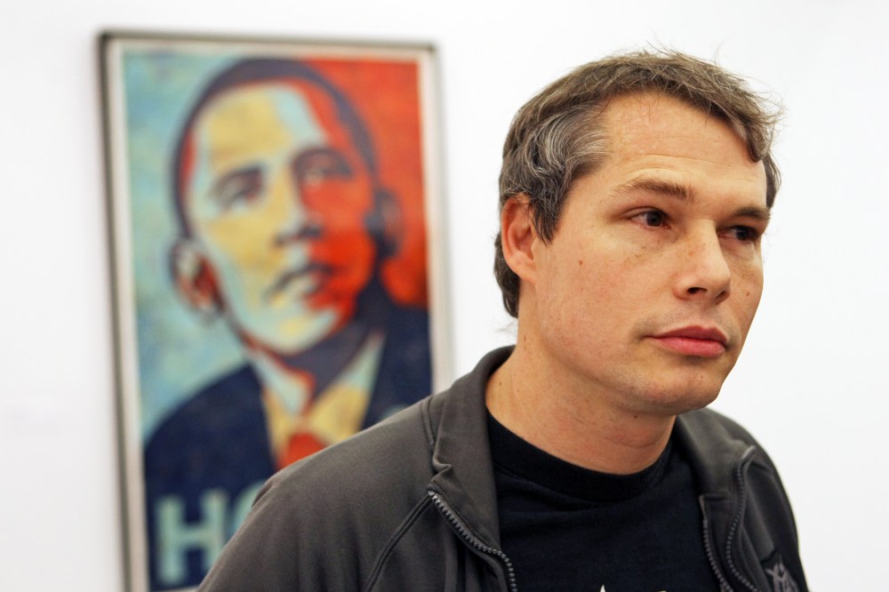 At the Institute of Contemporary Art, an exhibit of Shepard Fairey's first solo museum show with the Obama "Hope," 2008, over the artist's shoulder. (Photo by David L. Ryan/Boston Globe/Getty)