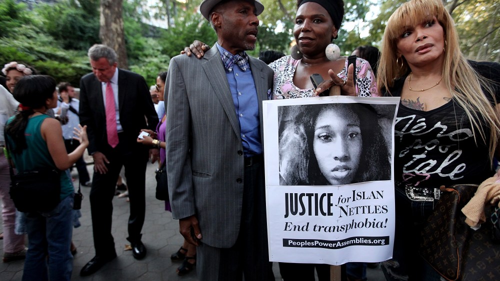 People gather along with Bill de Blasio (back, L) before a vigil for slain transgender woman Islan Nettles at Jackie Robinson Park in Harlem on Aug. 27, 2013 in New York City. (Photo by Mario Tama/Getty)
