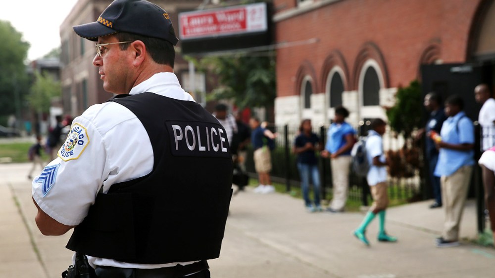 Chicago Police And Neighborhood Officials Escort Children To School