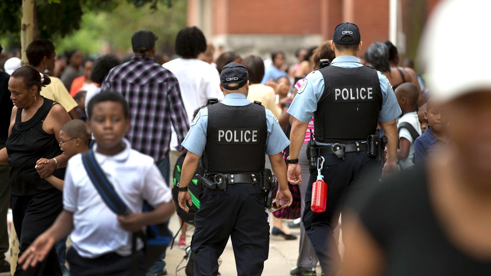 Chicago Police And Neighborhood Officials Escort Children To School