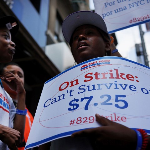 Employees and supporters demonstrate outside of a Wendy's and Burger King fast-food restaurants to demand higher pay and the right to form a union on August 29, 2013 in New York City.