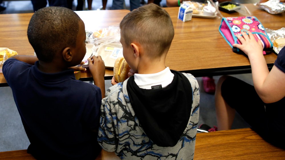 Children eat lunch at Roger Clap Innovation School in Dorchester, Mass., on Aug. 30, 2013