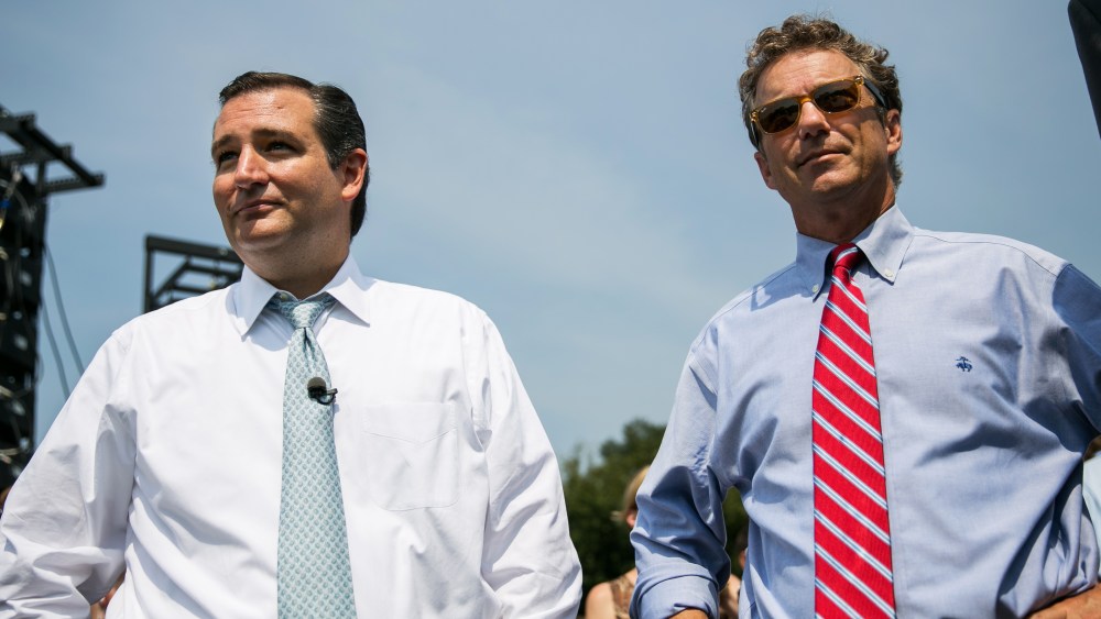 U.S. Sen. Ted Cruz (R-TX) (L) and Sen. Rand Paul (R-KY) wait to speak at the "Exempt America from Obamacare" rally,  on Capitol Hill on Sept. 10, 2013 in Washington, DC.