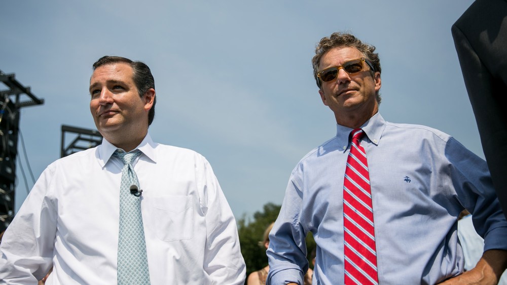 U.S. Sen. Ted Cruz (R-TX) (L) and Sen. Rand Paul (R-KY) wait to speak at an event on Sept. 10, 2013 in Washington, DC.