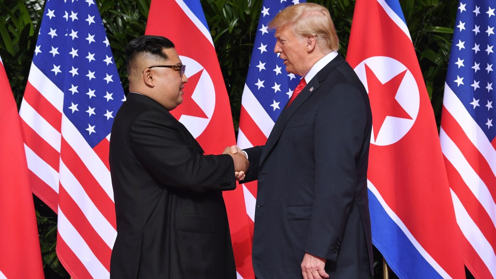 Image: North Korea's leader Kim Jong Un shakes hands with President Donald Trump