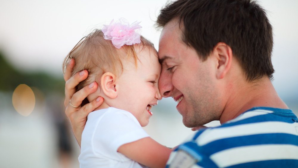 Image: Dad rubbing noses with baby
