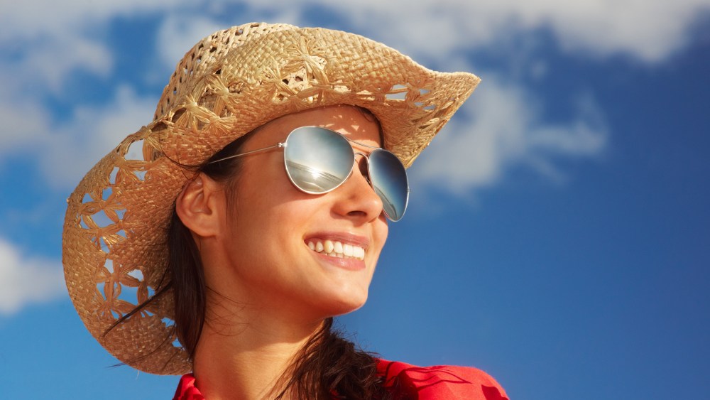 Image: Trendy young woman over the blue sky background