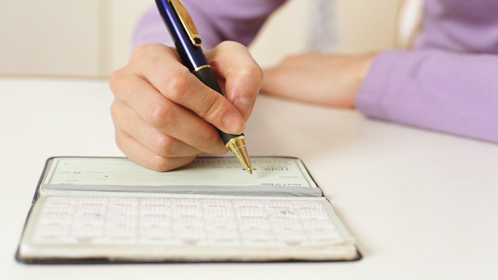Image: Writing in checkbook