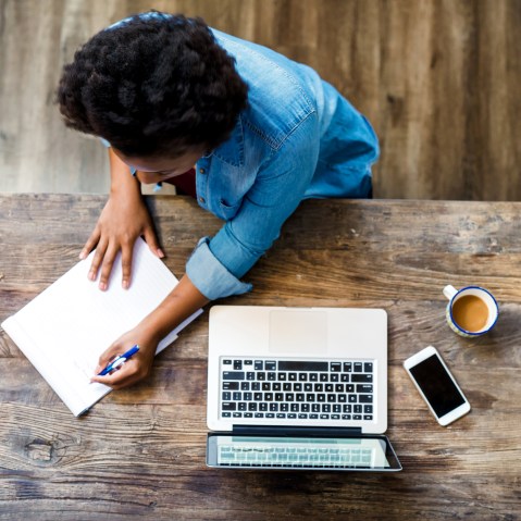Image: Overhead view of a woman using a computer