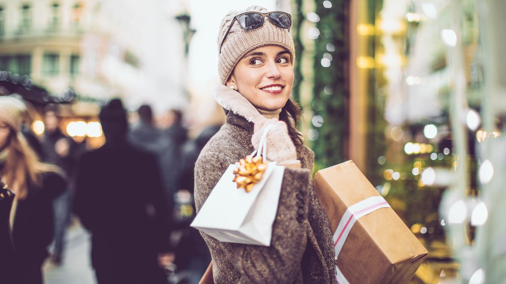 A woman carries her purchases
