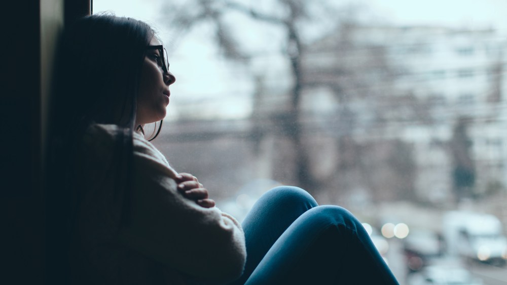 girl looking out the window