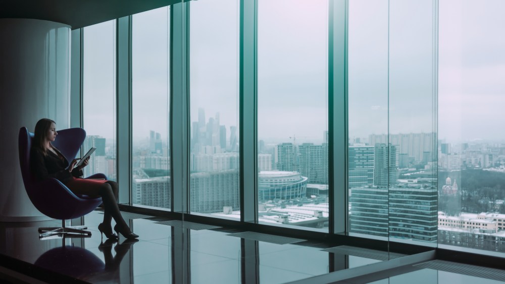 Image: Business woman seated on a chair