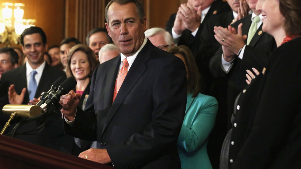 Speaker of the House Rep. John Boehner (R-OH) celebrates as he speaks during a rally as other House Republicans look on after a vote September 20, 2013 on Capitol Hill in Washington, D.C.