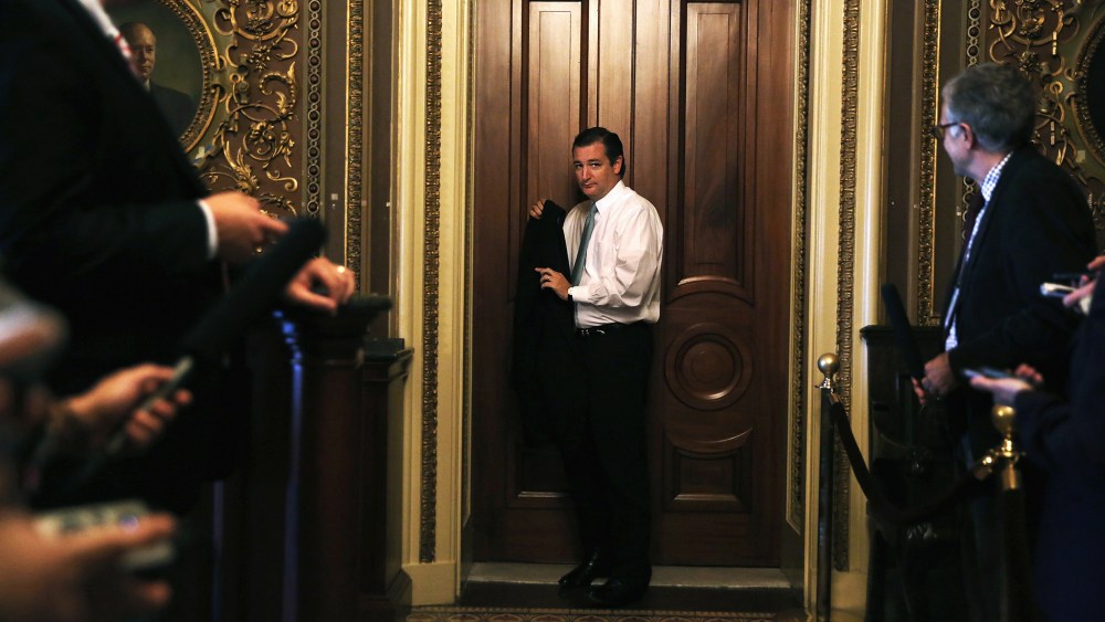 Sen. Ted Cruz (R-TX) leaves after the weekly Senate Republican Policy Committee luncheon, Sept. 24, 2013 on Capitol Hill in Washington, DC.