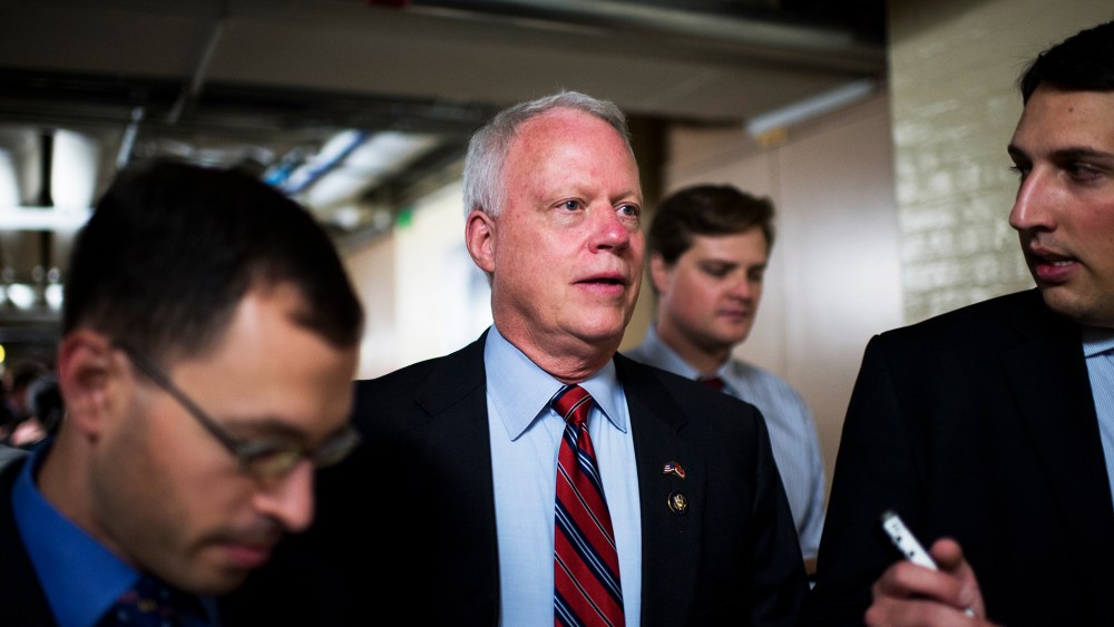 Rep. Paul Broun speaks with reporters as he leaves the House Republican Conference, Sept. 26, 2013.